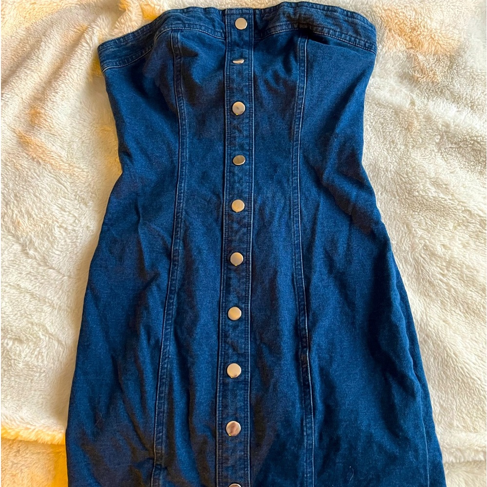 Jean dress really cute no rips just to small for me unfortunately!